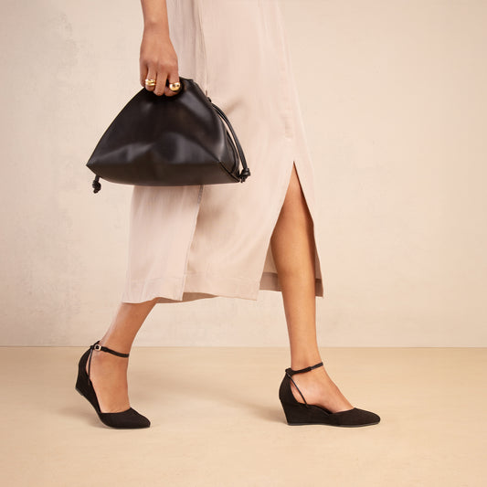Landmark Space black suede wedge that looks like a heel and feels like a sneaker
