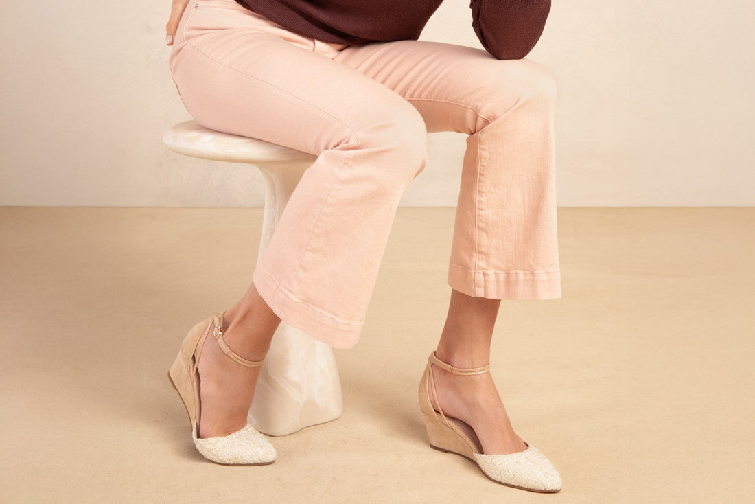 Landmark Pearl cream tweed-toe wedges worn with blush trousers