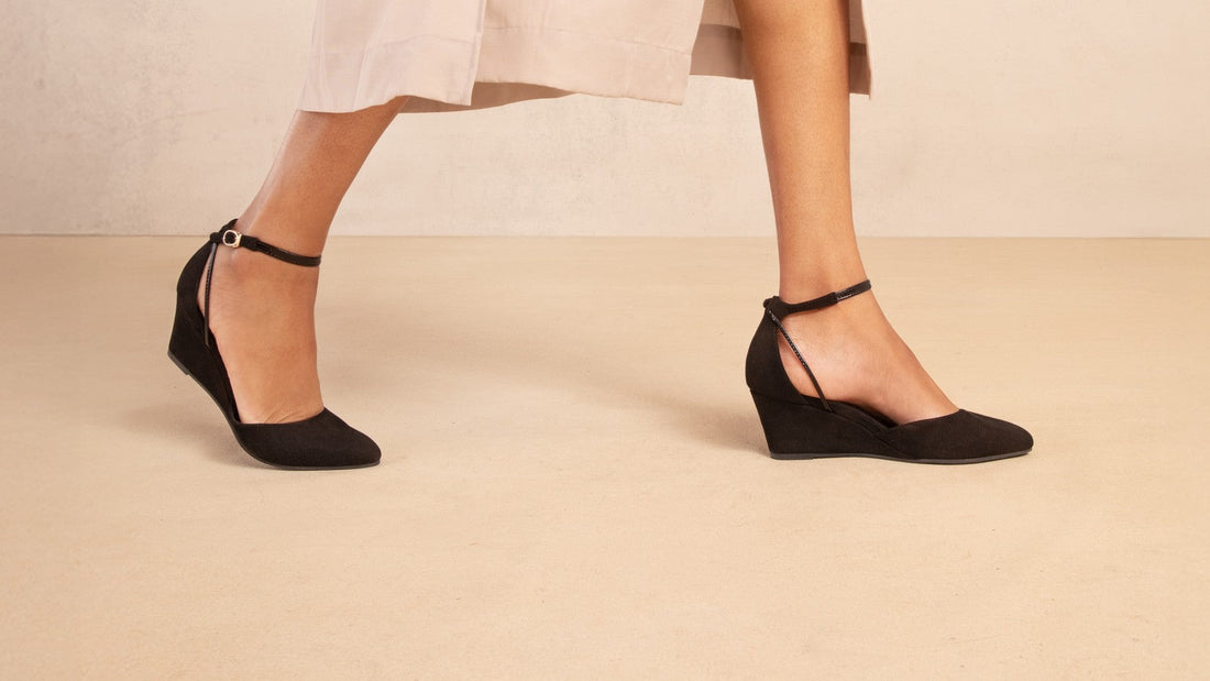 Landmark Space black suede wedges worn with a blush slip dress
