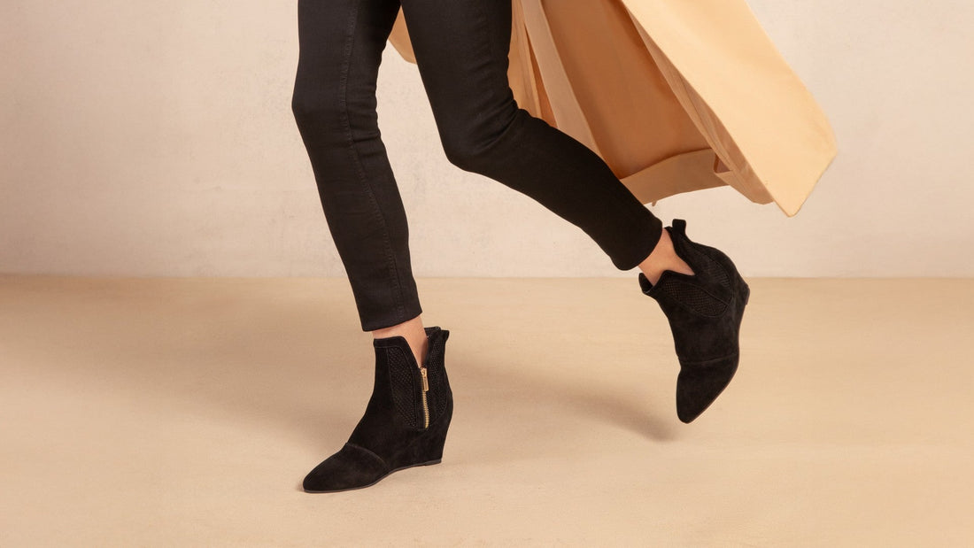 Explorer Space black suede wedge boots worn with black jeans