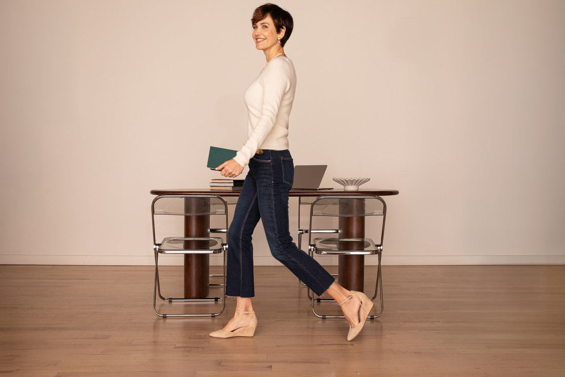 Landmark Safari nude suede wedges walking past an office desk