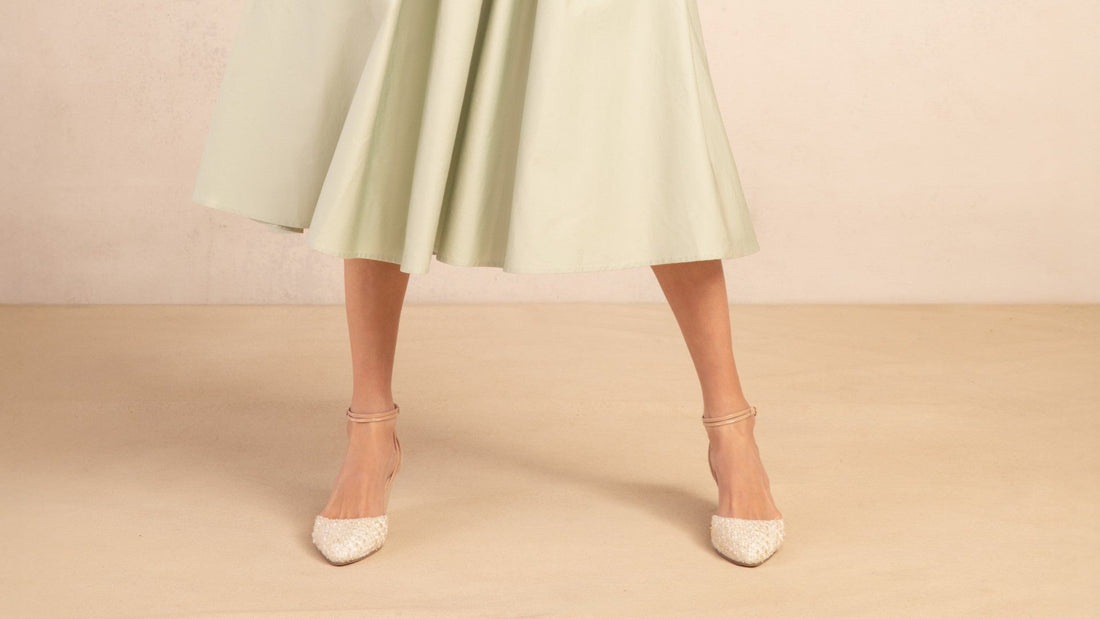 Landmark Pearl cream tweed-toe wedges worn with a sage midi dress
